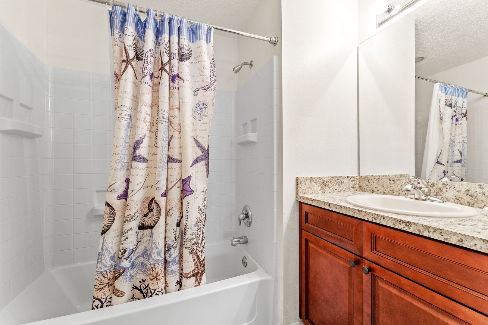 Ensuite bath with oversized vanity and shower/tub combo