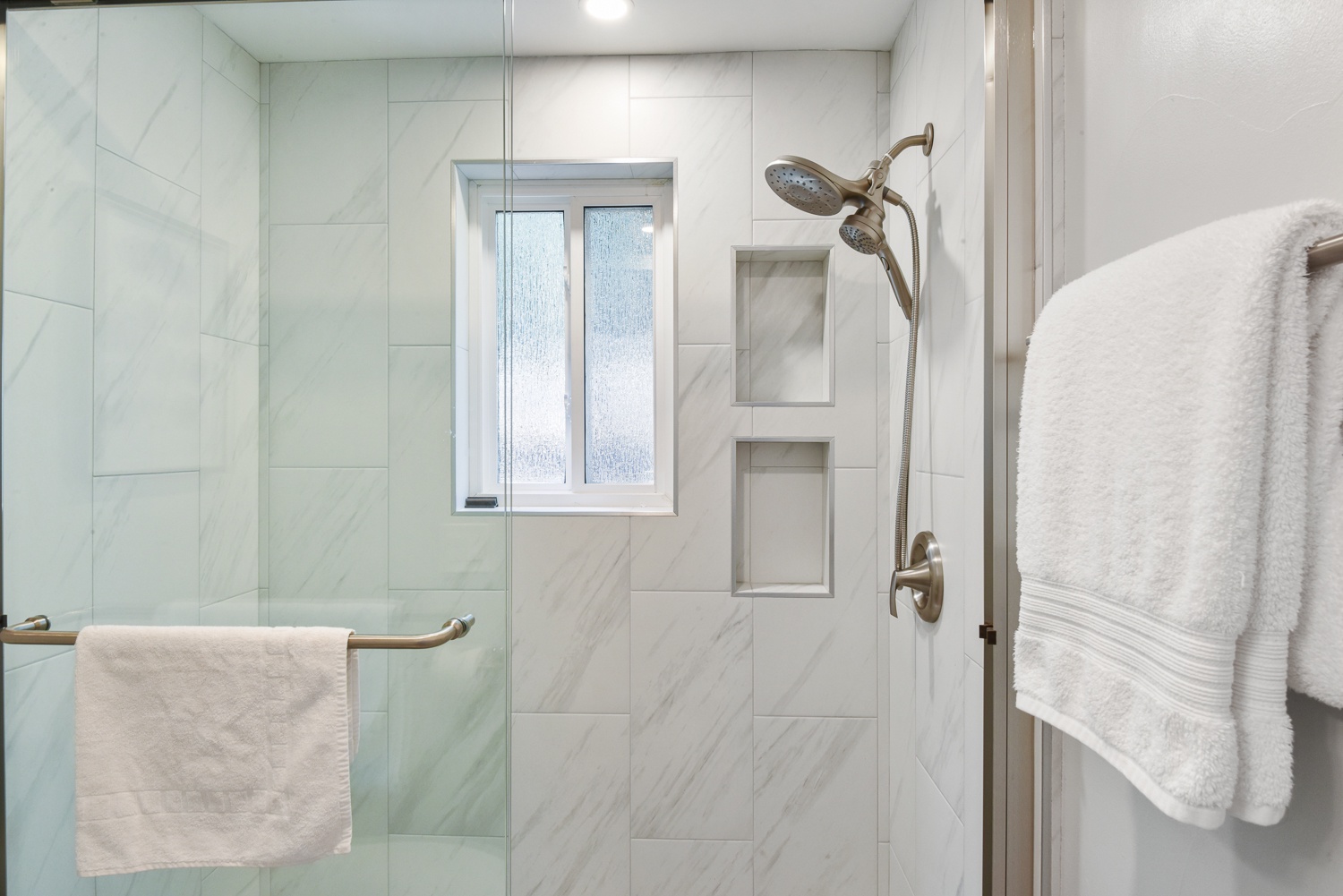 The 2nd level offers a convenient full bathroom with a glass-enclosed shower