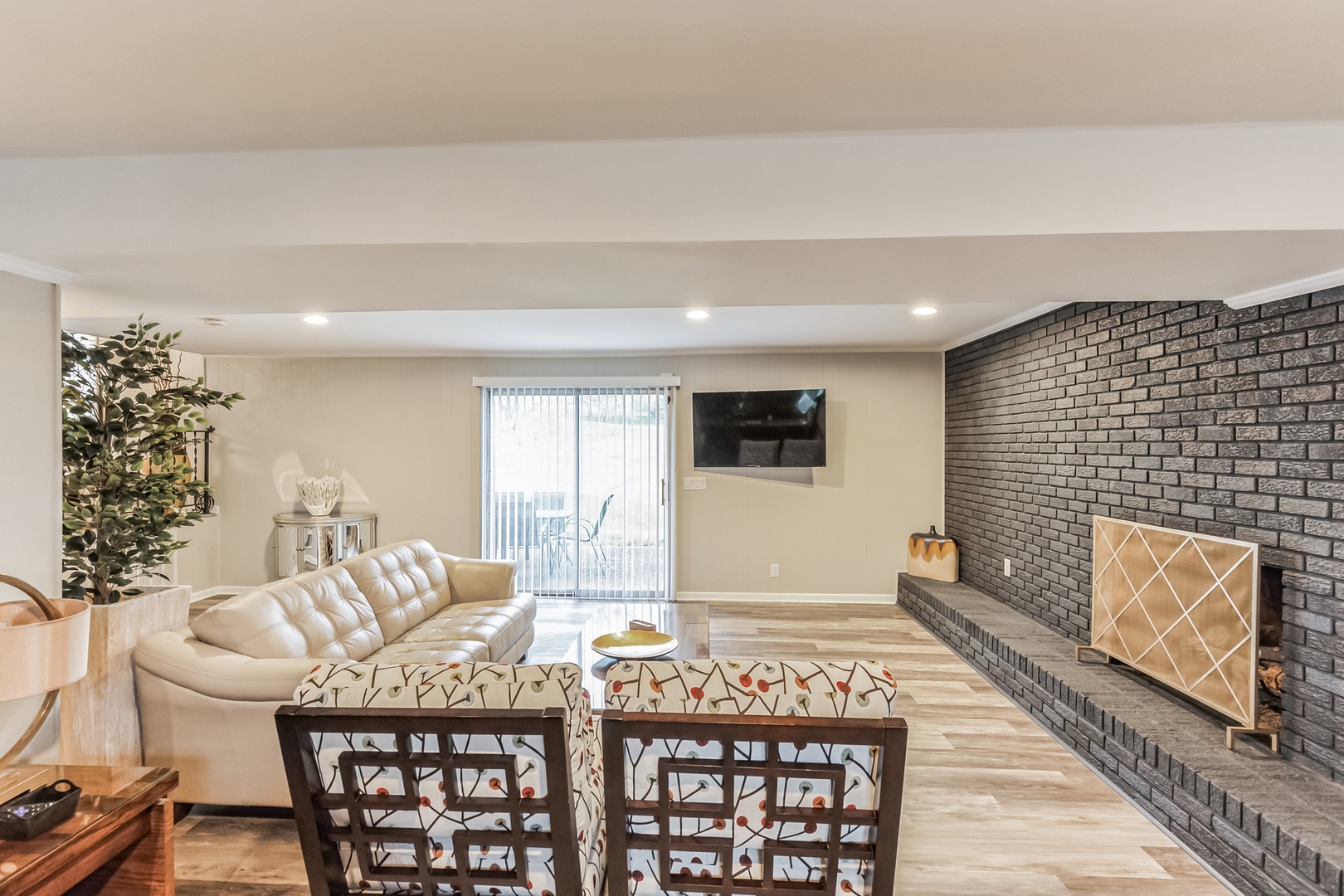 Living area with ample seating, Smart TV, and bar