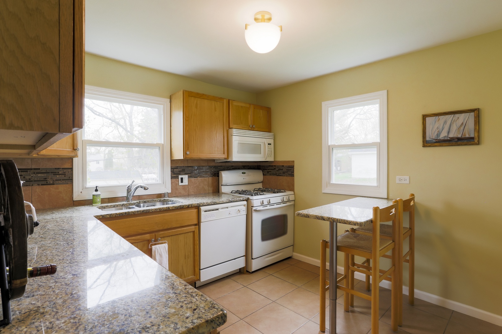 Enjoy morning coffee and meals in the kitchen, offering table seating for 2