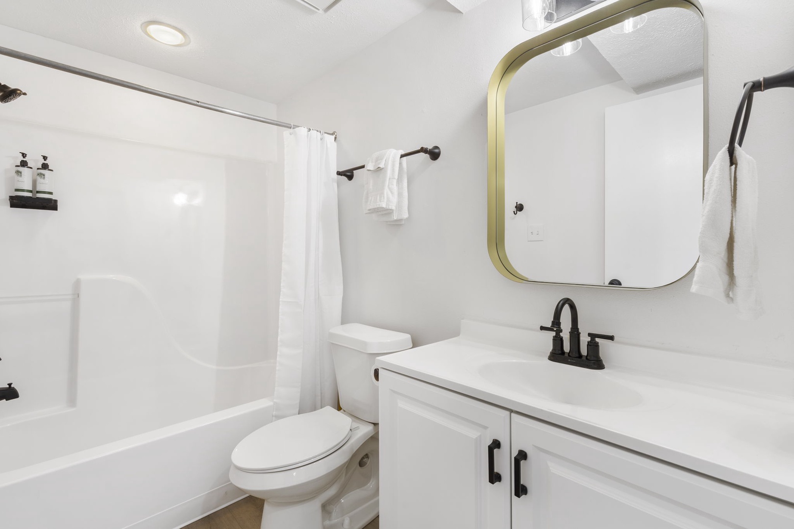 The 1st floor full bathroom includes a single vanity & shower/tub combo