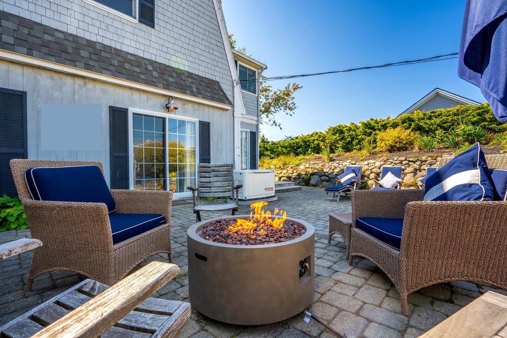 Inviting front patio with cozy fire pit for relaxation