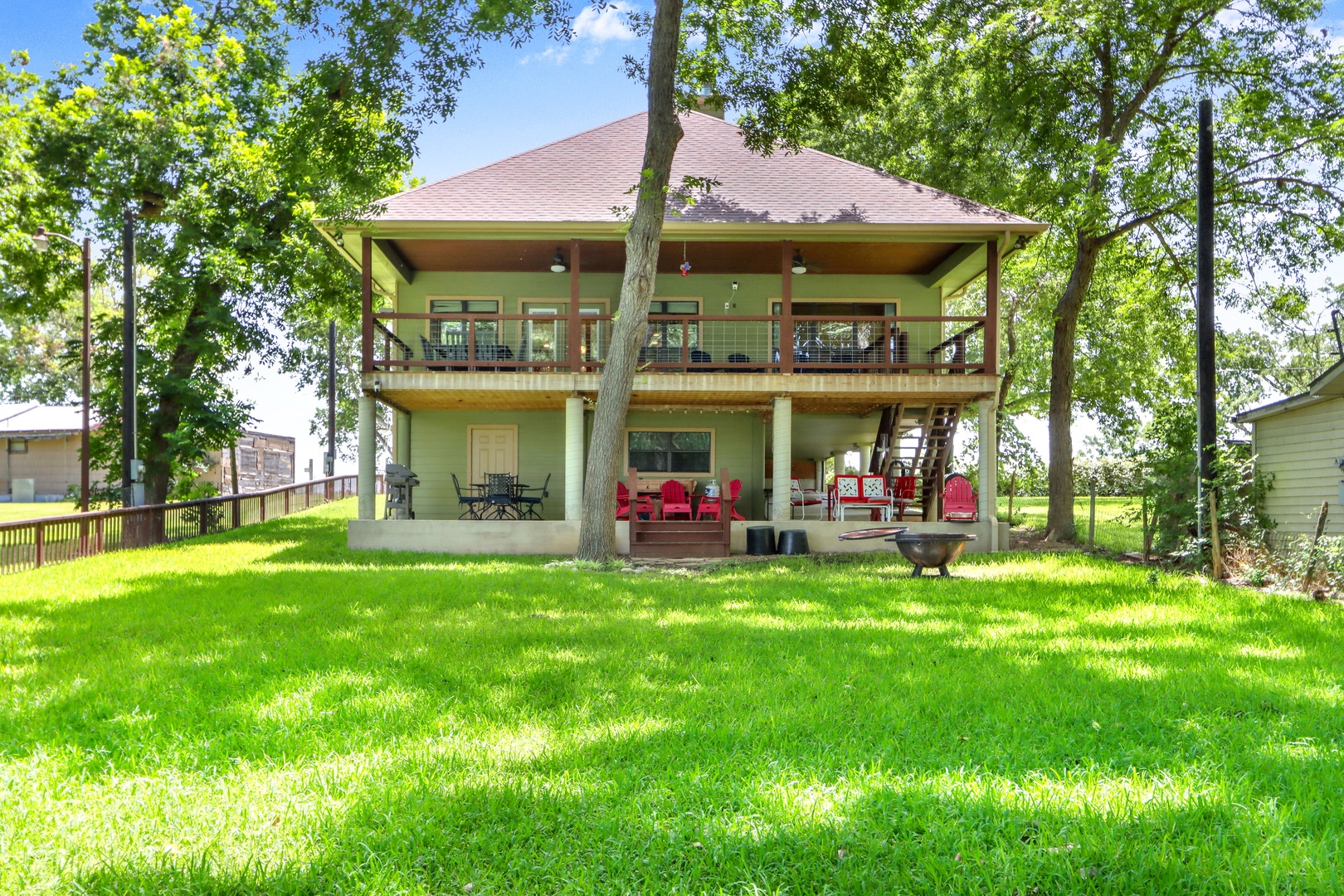 The shady back yard offers loads of room for relaxation & play