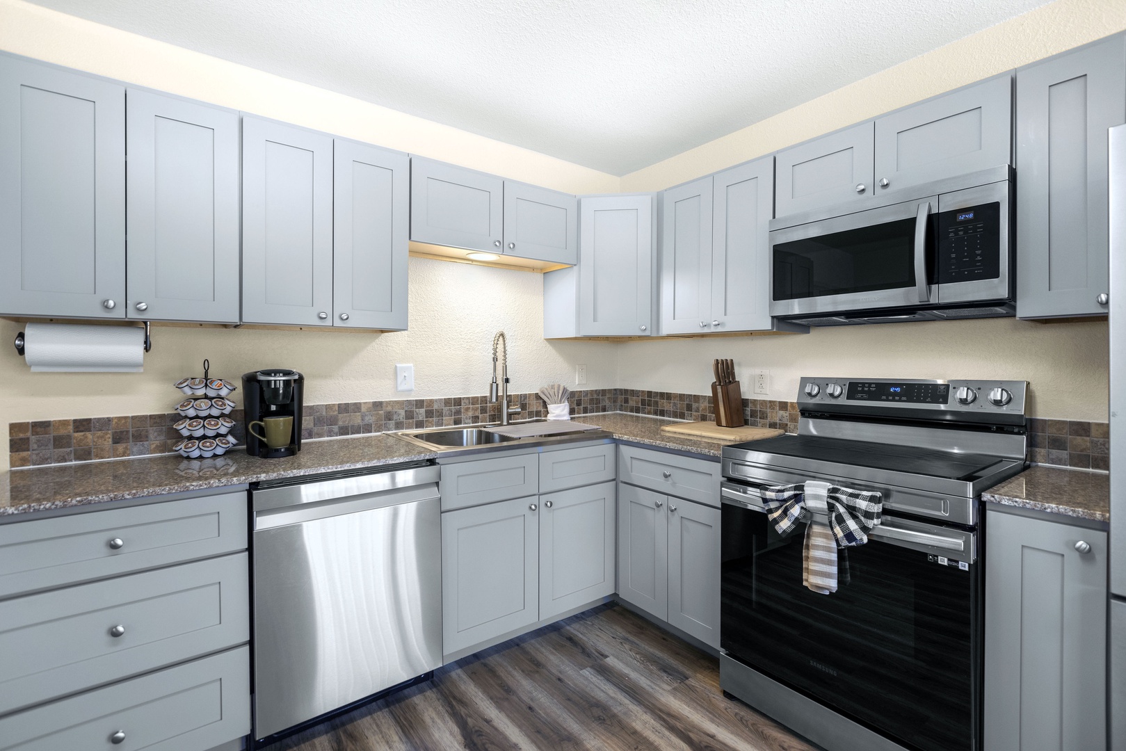 The 1st of 2 full kitchens offers ample space & all the comforts of home