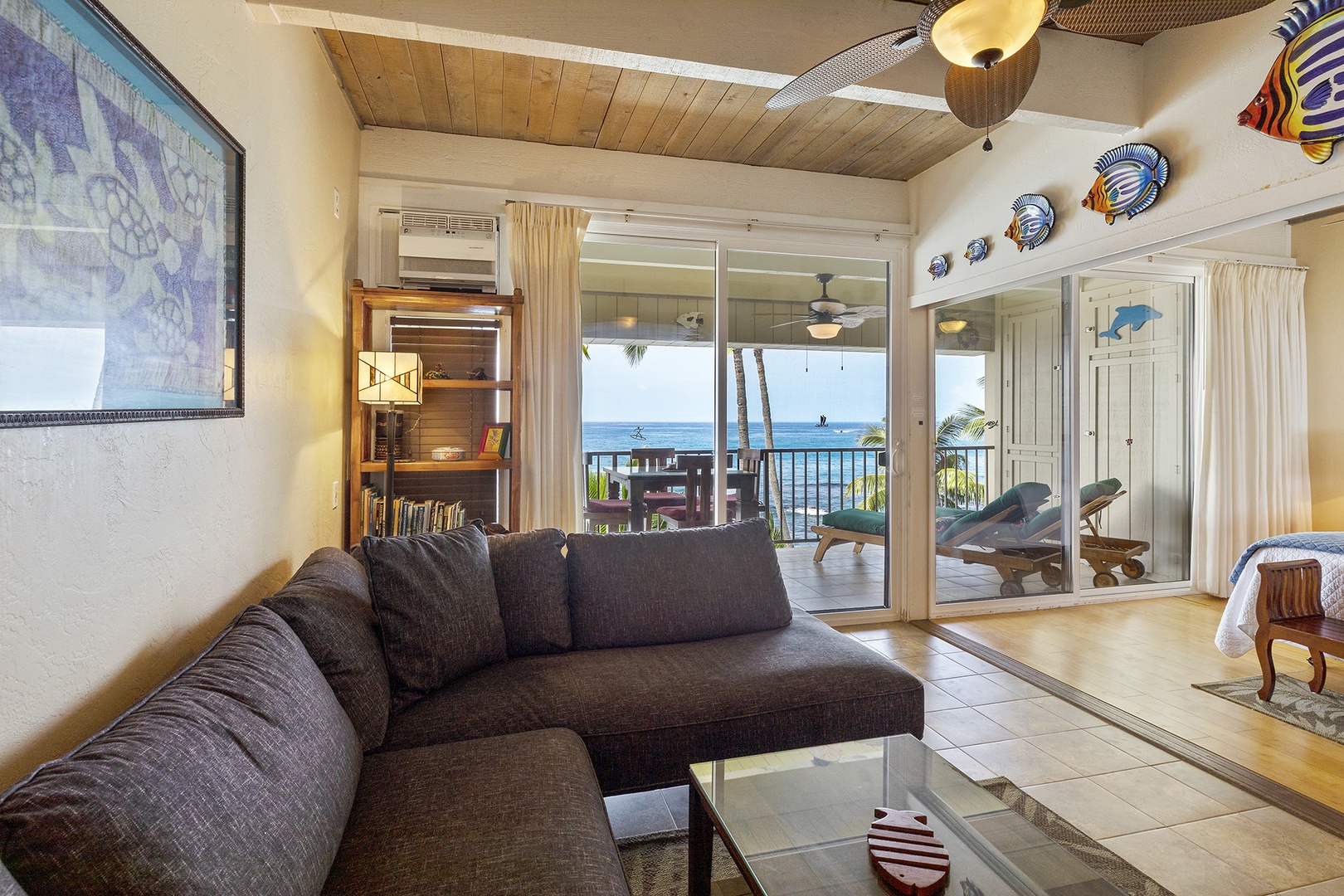 Living room with flat screen TV, ocean views