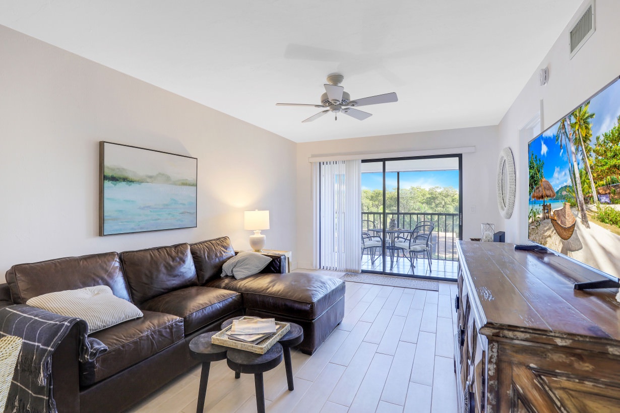 Open living space with, TV, and lanai