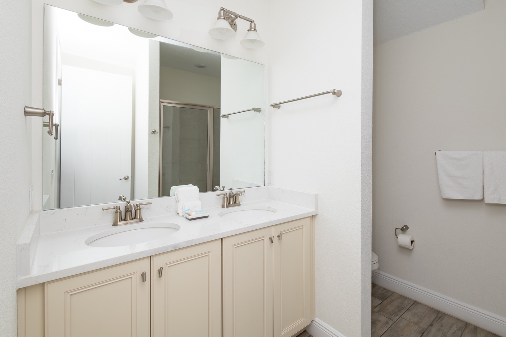 Private bathroom with dual vanity and  walk-in shower ensuite to 2nd floor king bedroom
