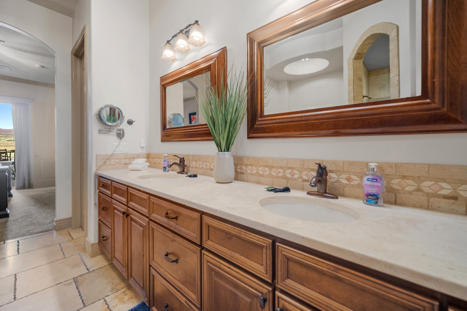 The ensuite features a double vanity, shower, & luxurious soaking tub