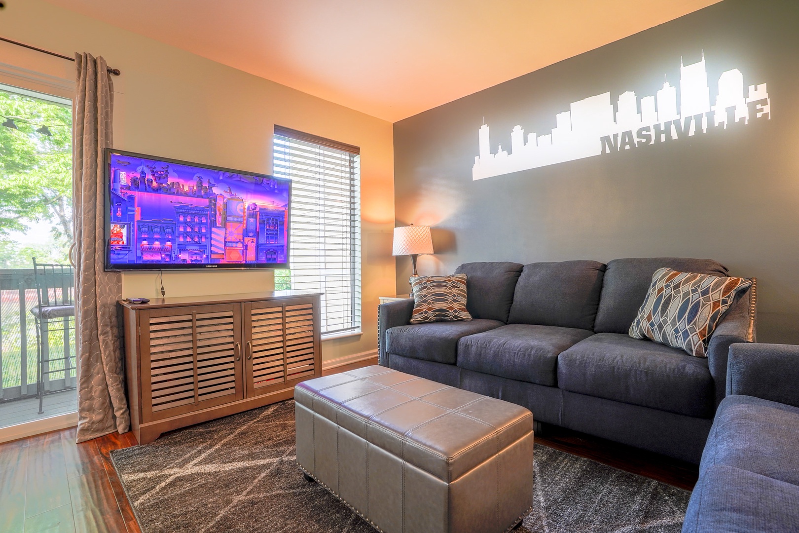 Living room with sofa sleeper, Smart TV, balcony access