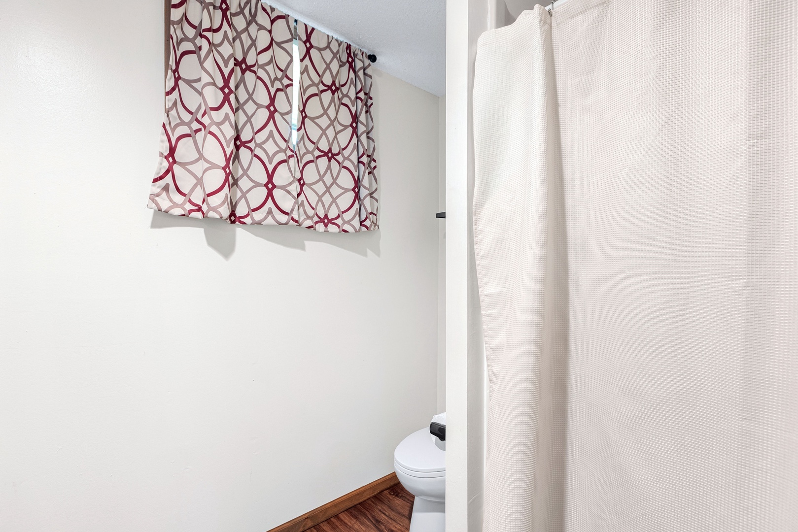 This lower-level full bath features a single vanity & shower