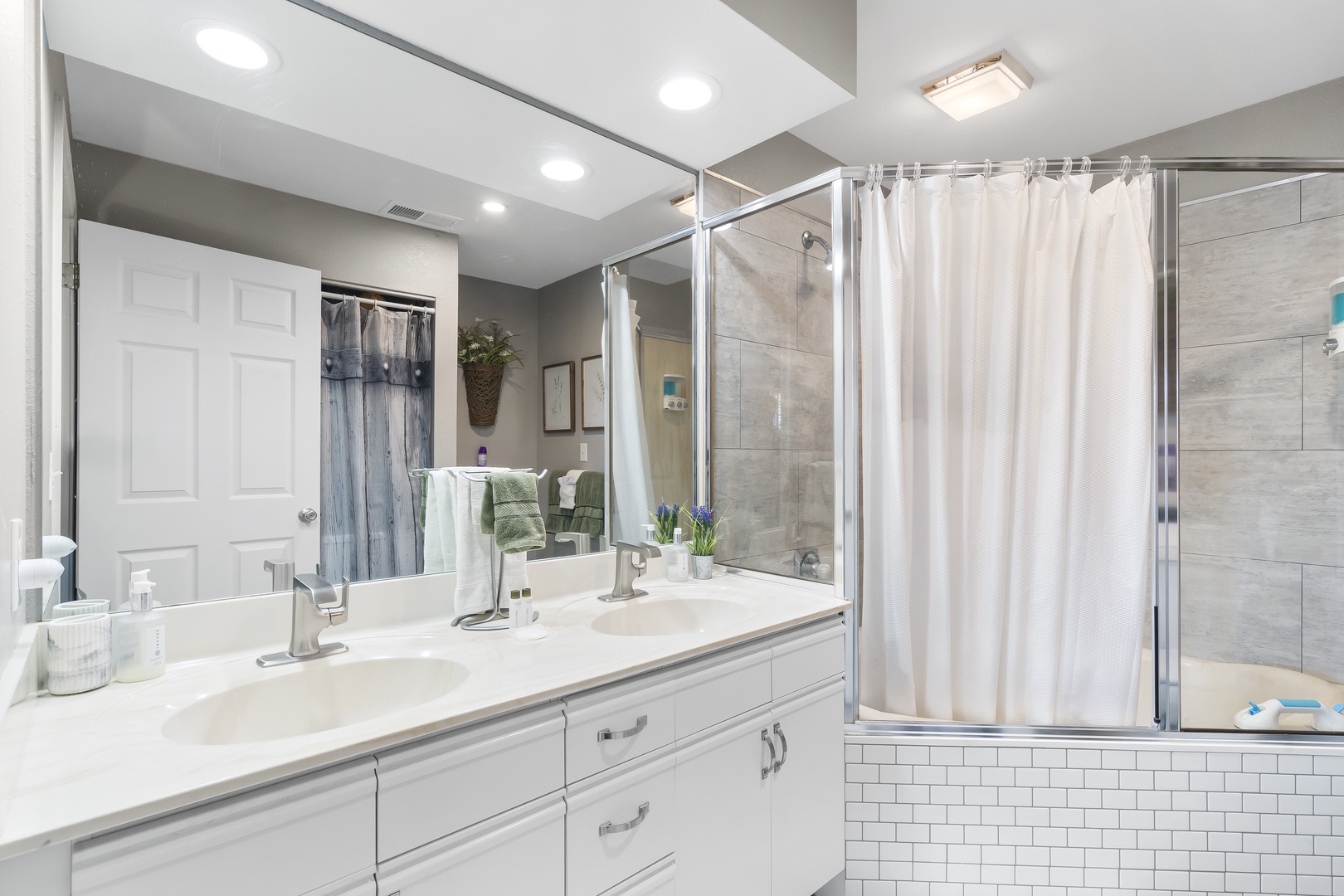 This ensuite bath features a double vanity & shower/soaking tub combo