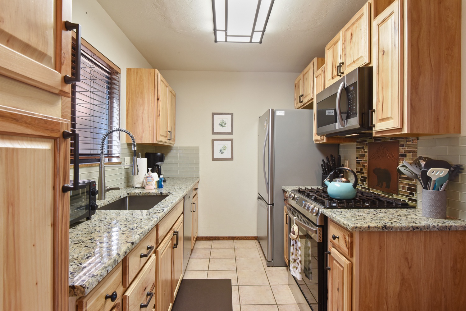 The updated kitchen boasts ample storage space & all the comforts of home