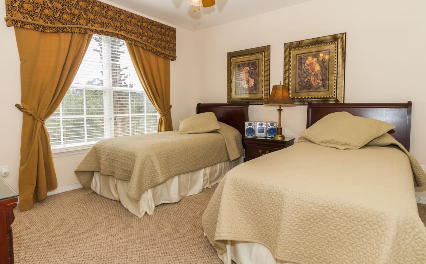 A pair of cozy twin beds awaits in the tranquil third bedroom