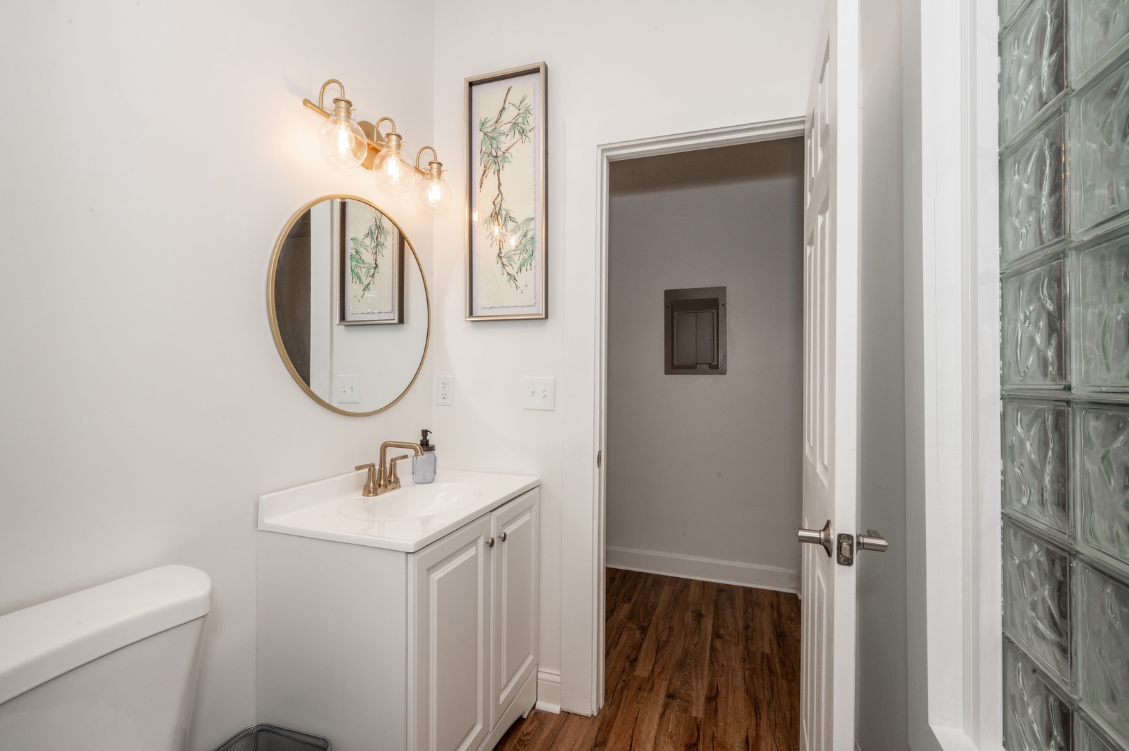 Unit 3: Ultra-stylish bathroom with single vanity & glass shower