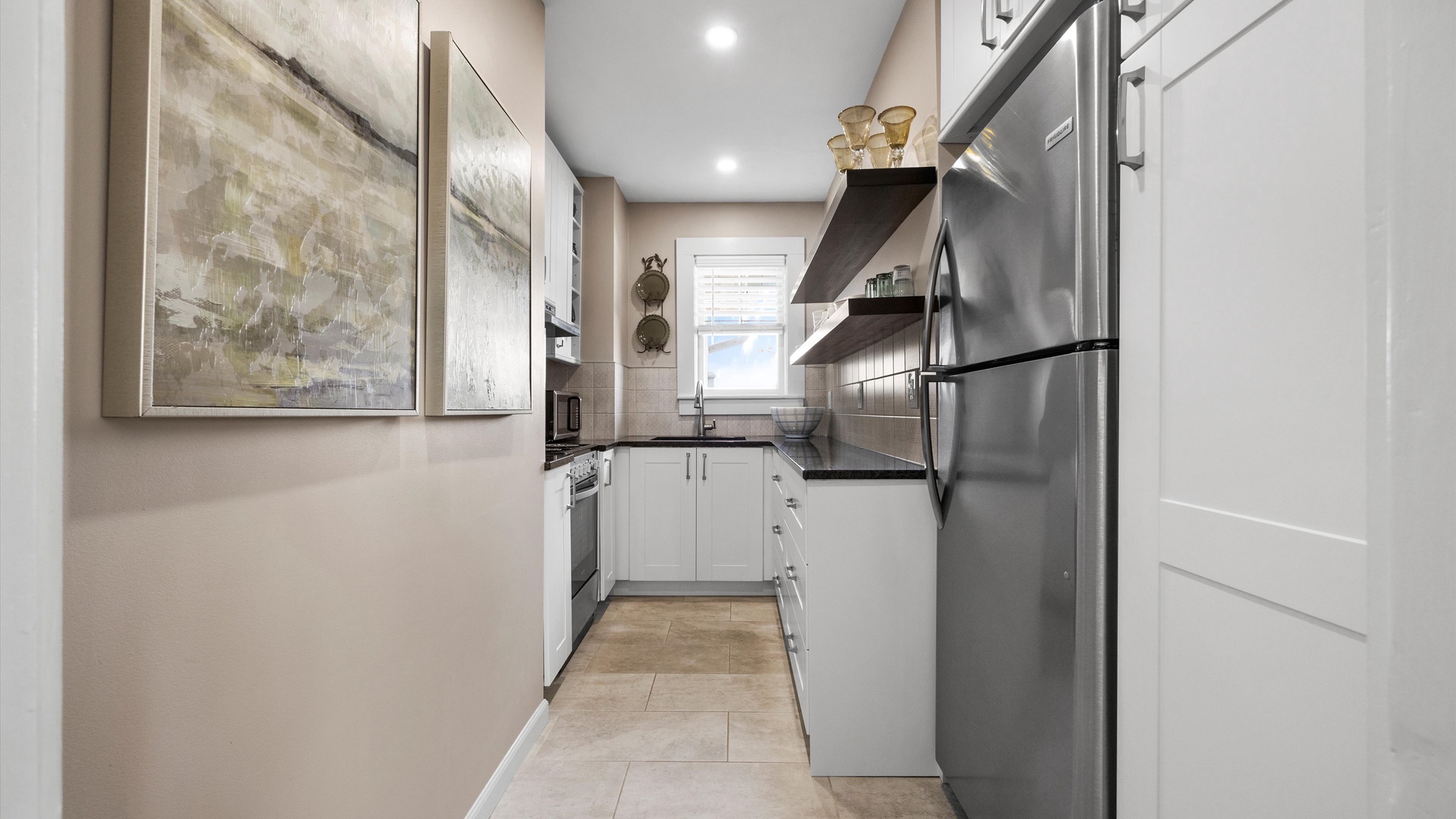 The cozy kitchen offers ample storage space & all the comforts of home