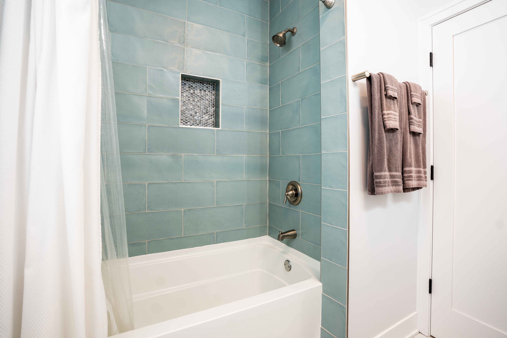 This peaceful full bath includes a shower/tub combo