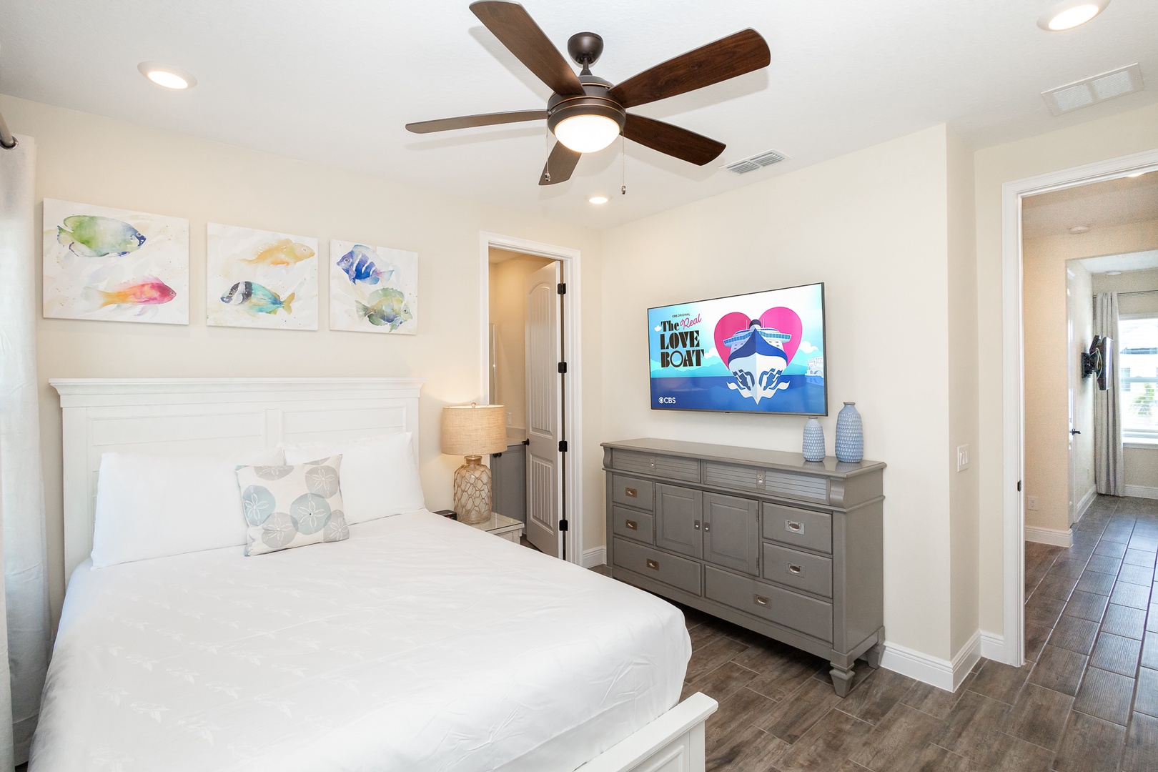 The queen suite includes a private en suite, Smart TV, & ceiling fan