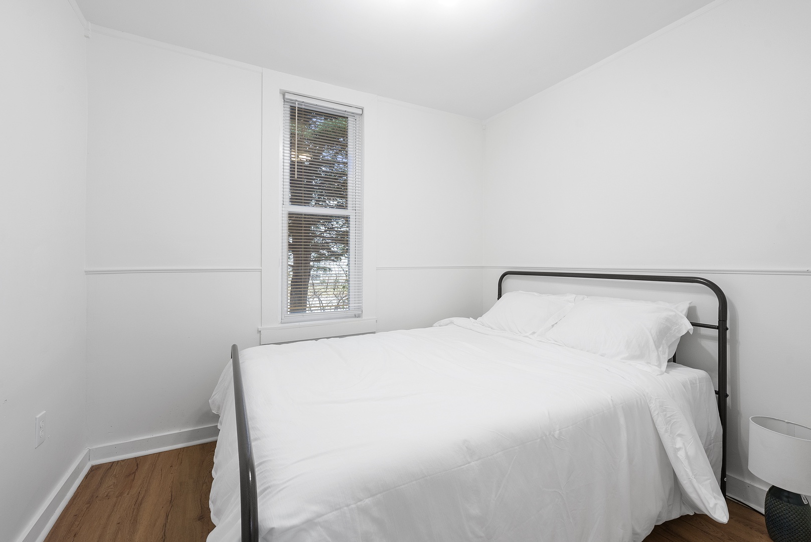This 1st floor bedroom retreat offers a plush queen-sized bed