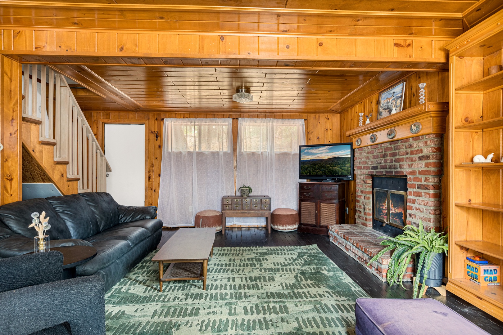 Living area with ample seating, Smart TV, and fireplace