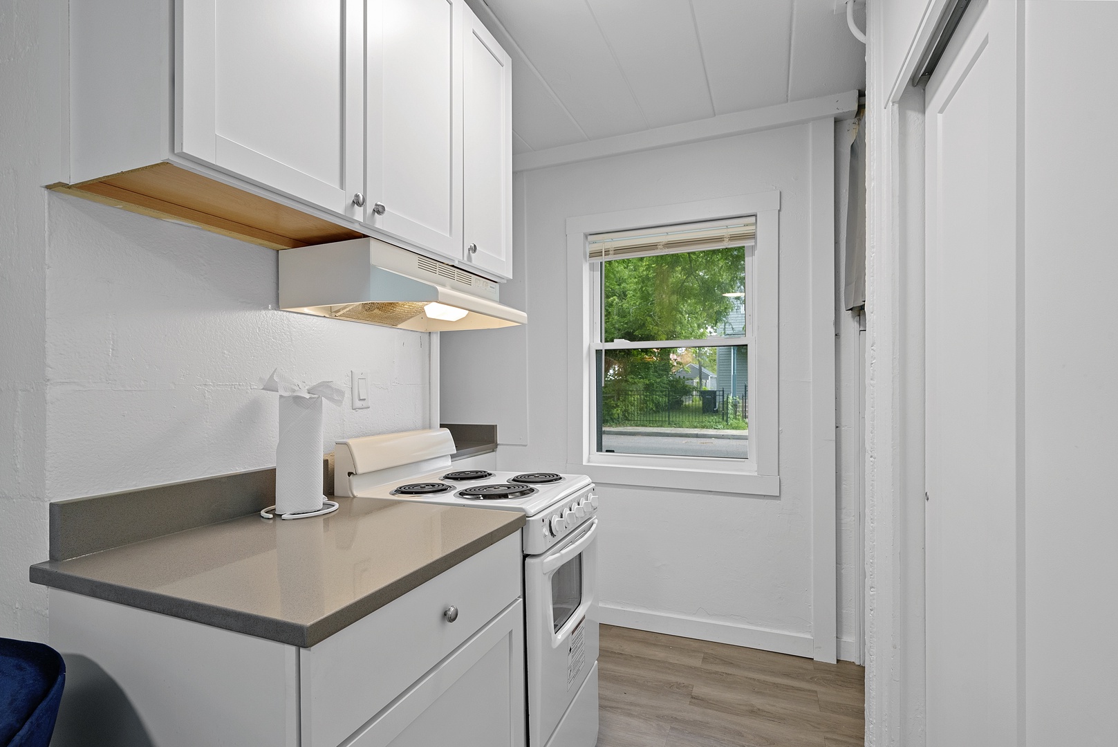 The cozy kitchen offers ample storage space & all the comforts of home