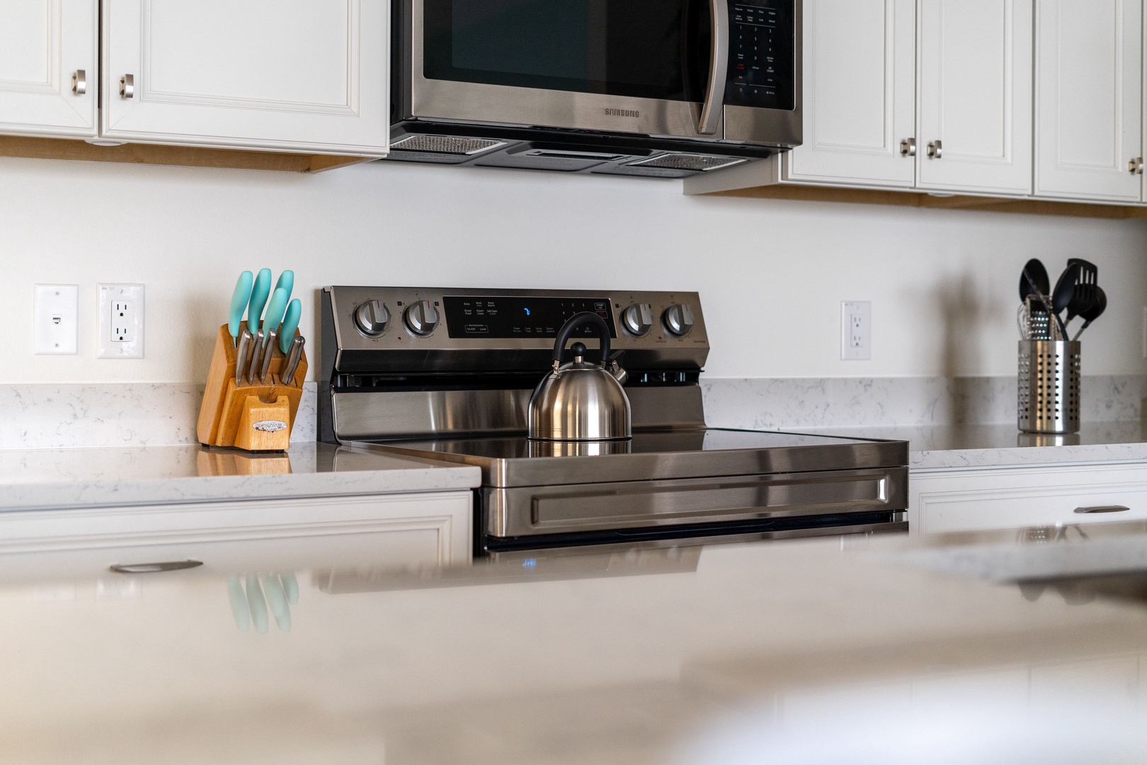 The open, airy kitchen offers ample space & all the comforts of home