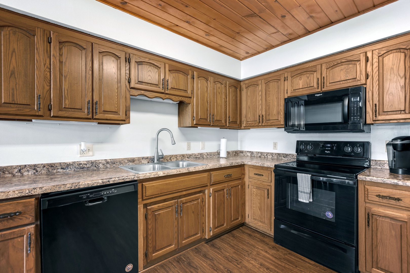 The open kitchen offers ample space & all the comforts of home