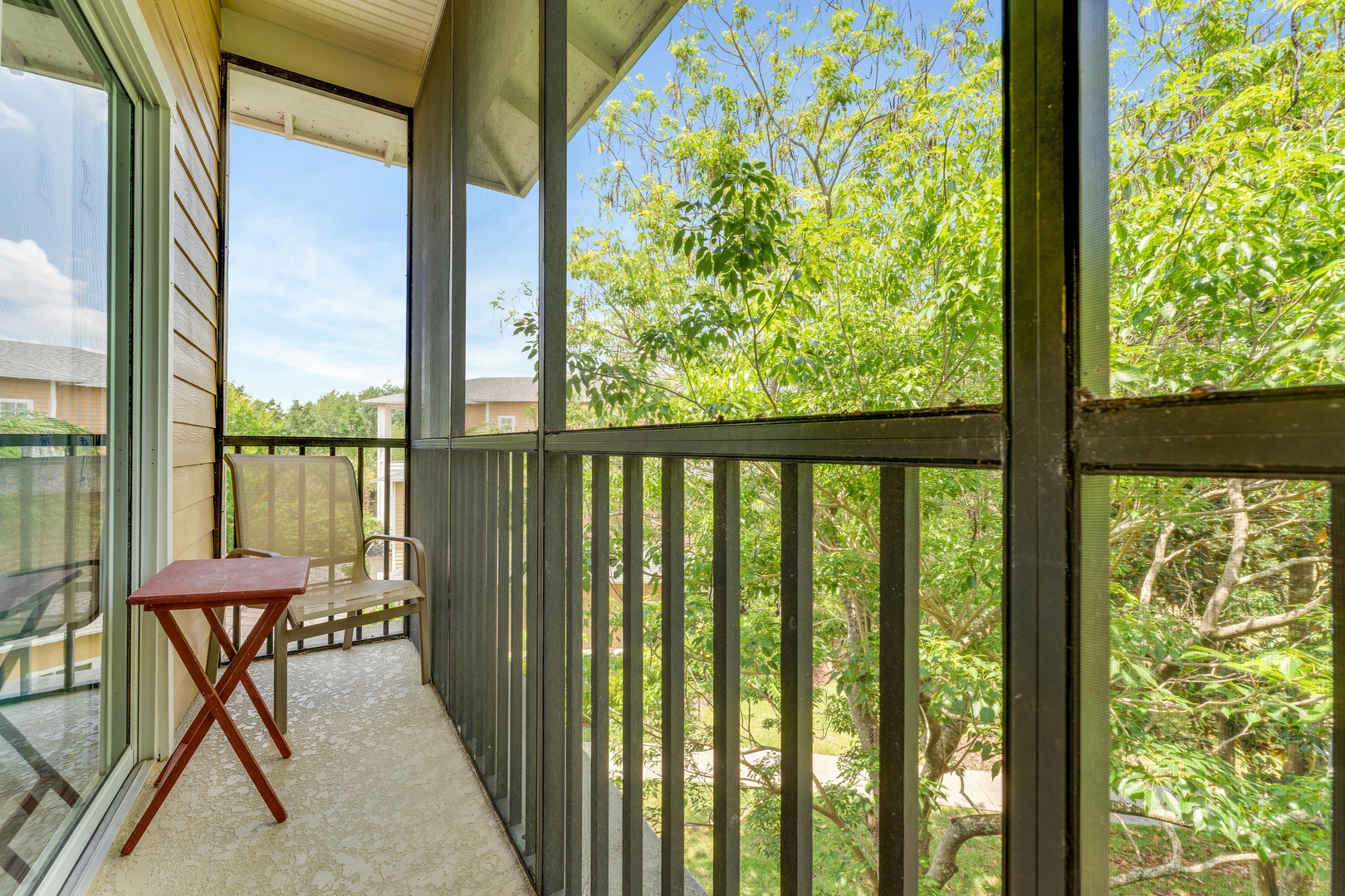 The tranquil queen suite offers an attached bath, TV, & balcony access