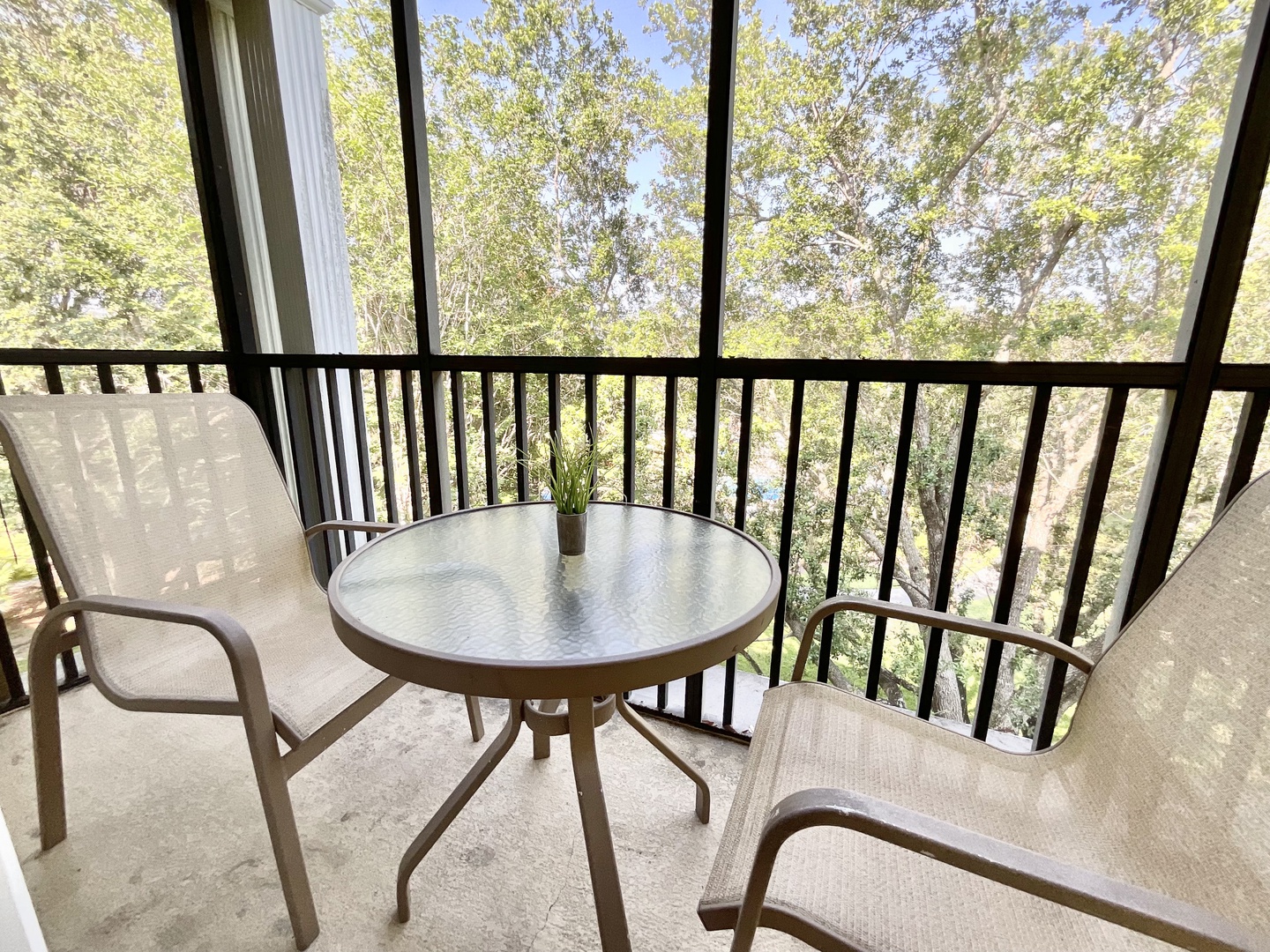 Enjoy the fresh air on the screened in balcony