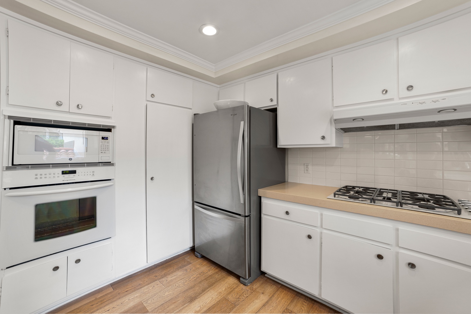 The open, airy kitchen offers ample space & every home comfort