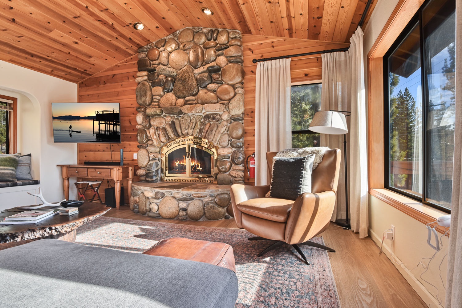 Sophisticated living space with a Smart TV, abundant seating, and a fireplace