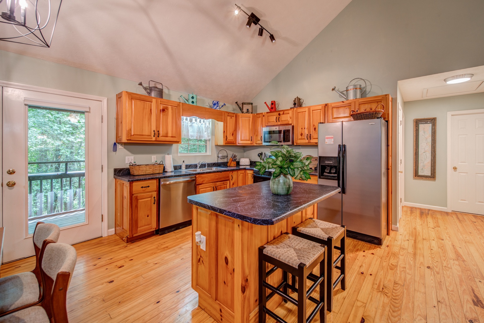 The open kitchen offers ample storage space & all the comforts of home