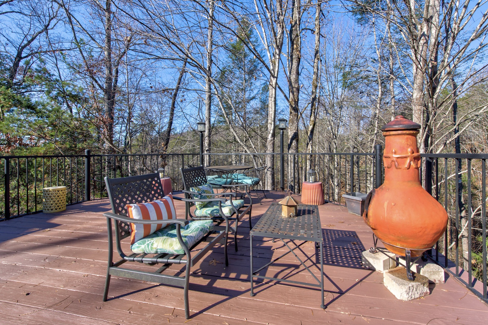 Expanded deck with outdoor seating, and wood burning stove