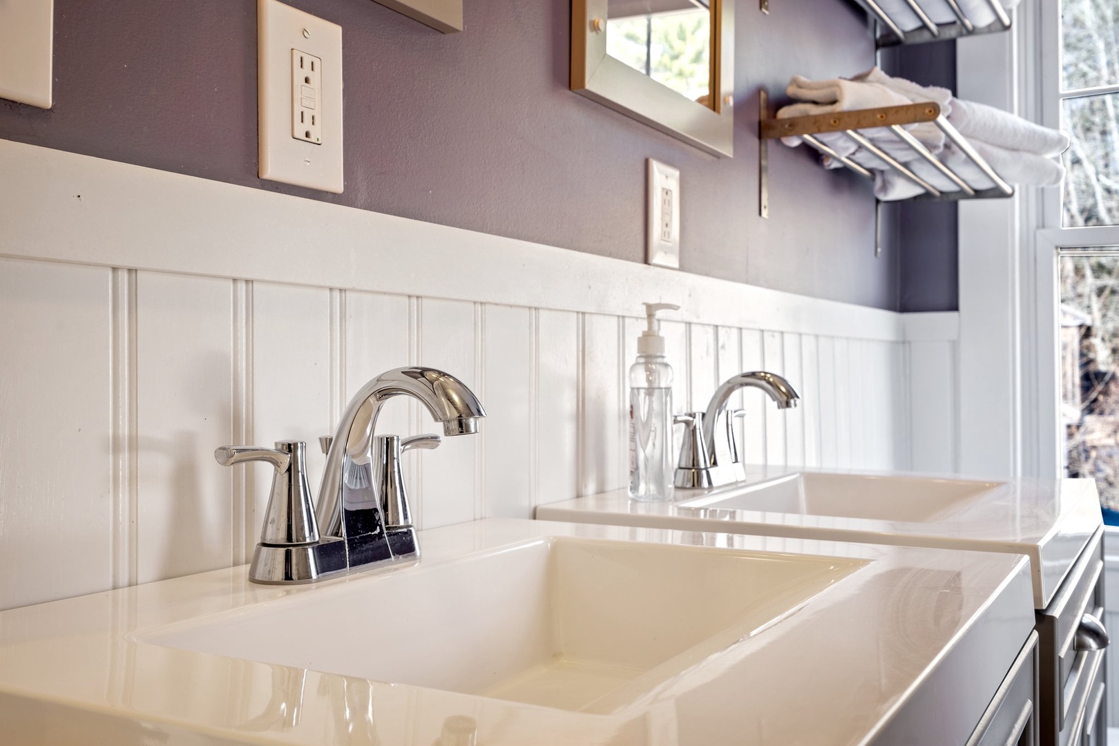 A double vanity, shower/tub combo available on the first floor shared bath