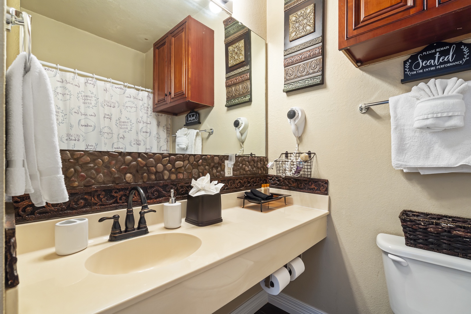 The bathroom includes a single vanity & shower/tub combo