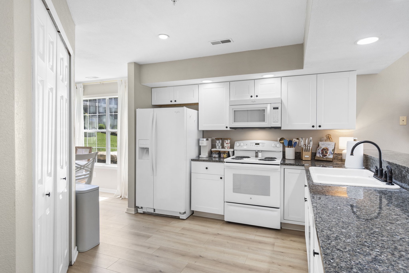 The open, well-equipped kitchen offers plenty of storage & counter space