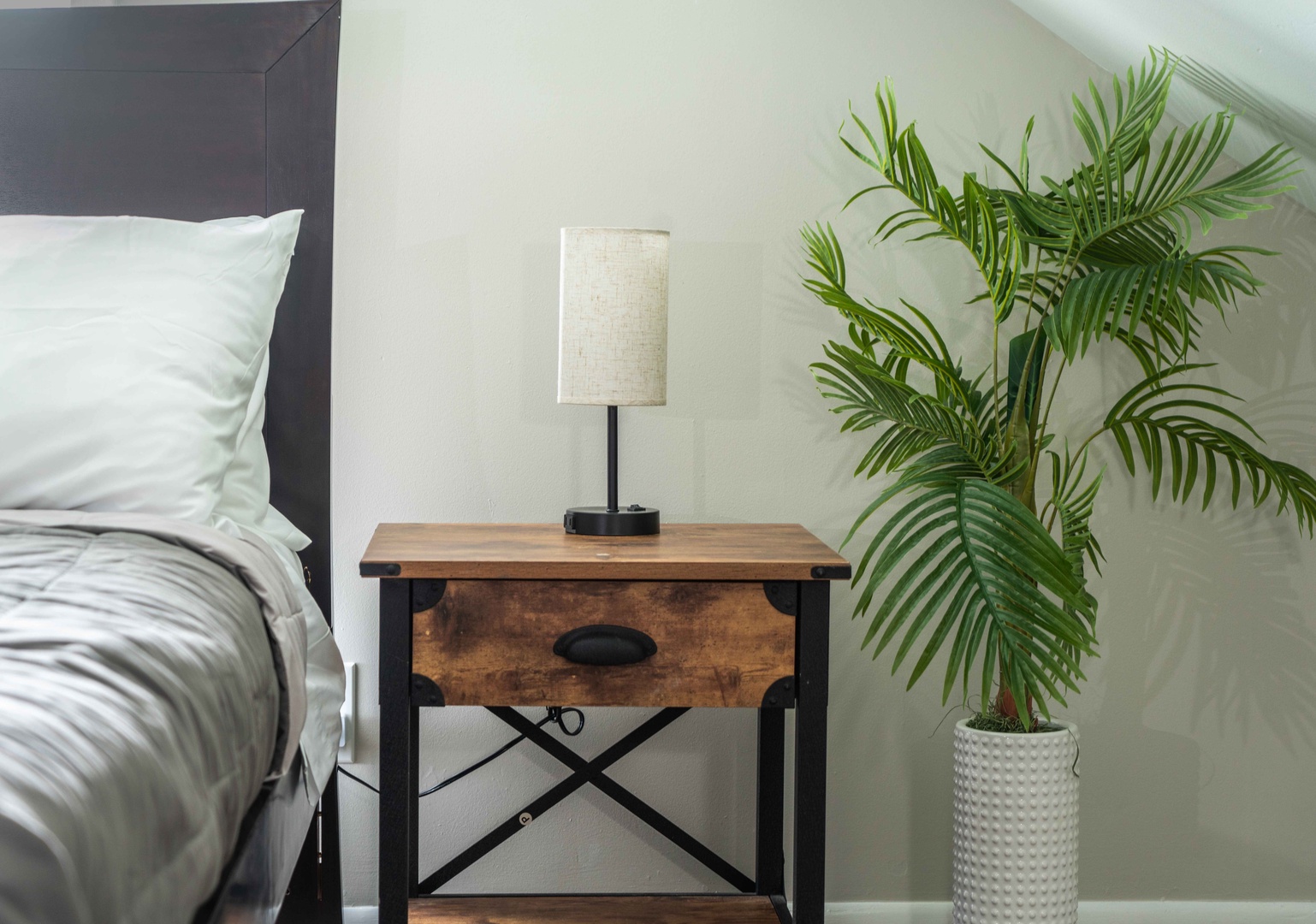 The serene 2nd-floor bedroom boasts a pair of full-sized beds & smart TV