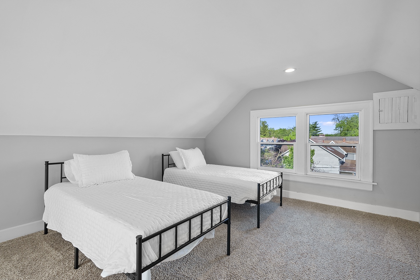 The third floor includes a pair of cozy twin beds & an additional living area