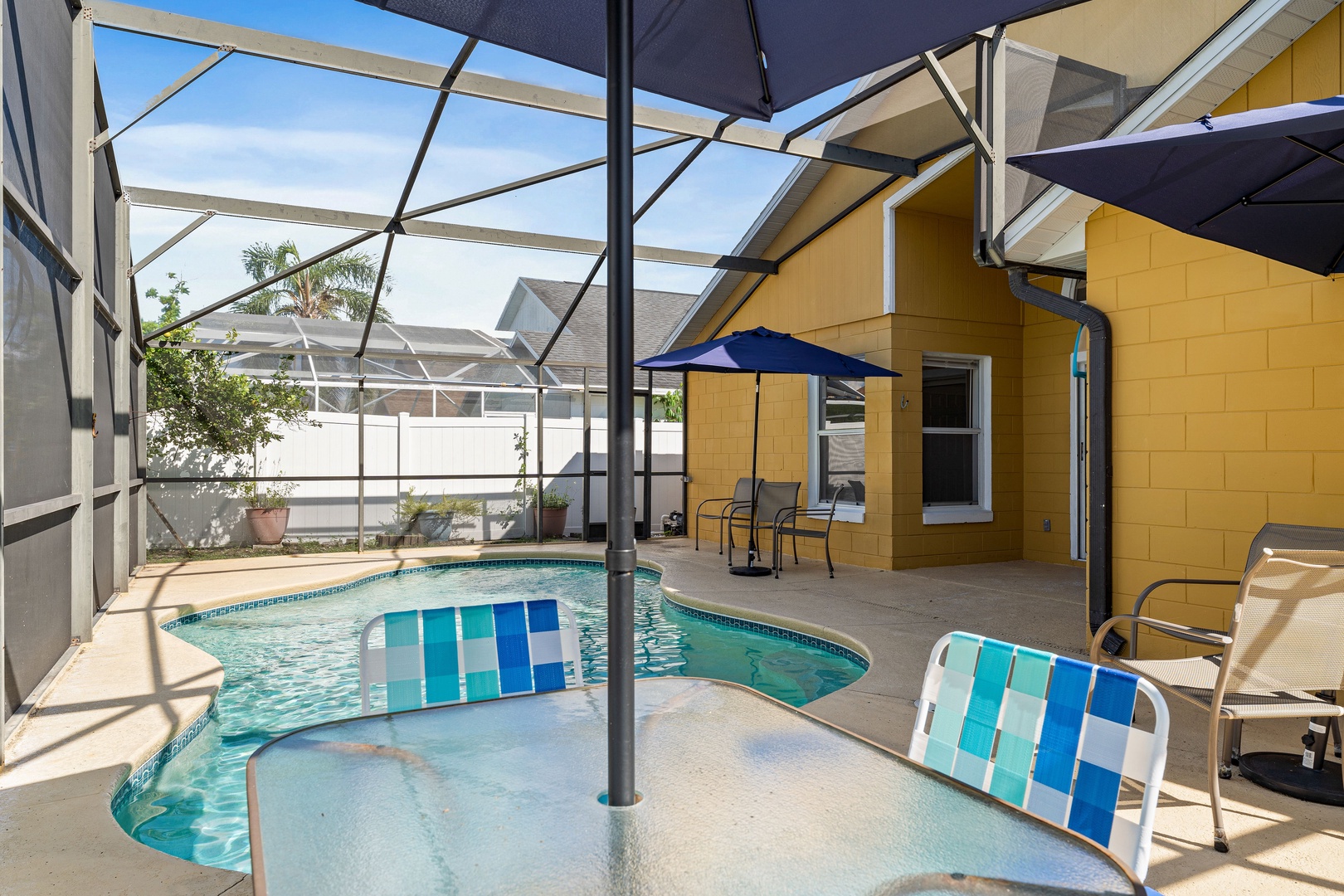 Screened in pool with outdoor seating