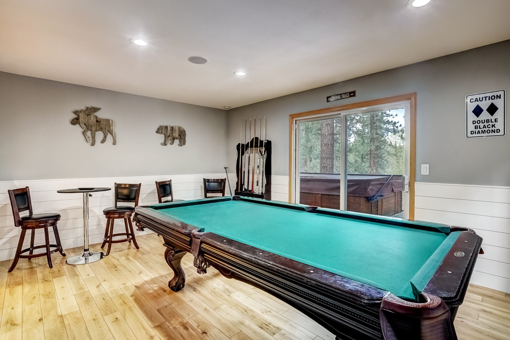 Game room with pool table, balcony access to hot tub