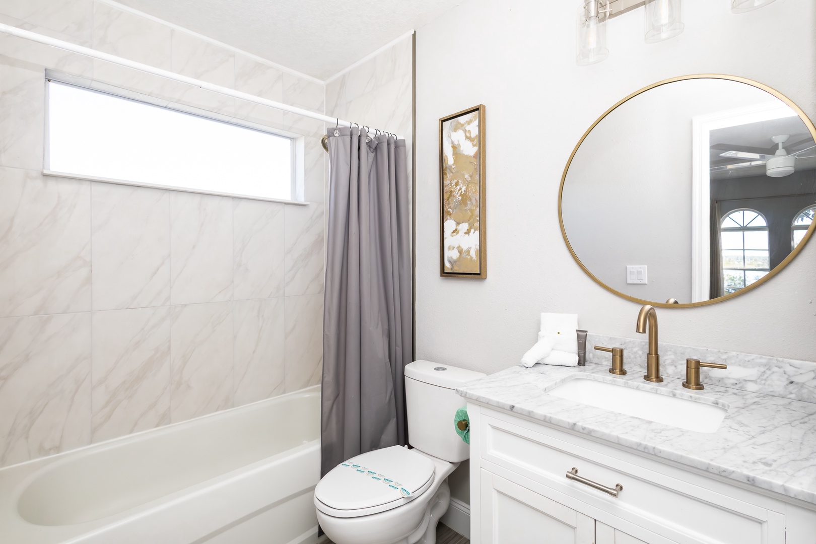 This ensuite bath features a double vanity with shower/tub combo