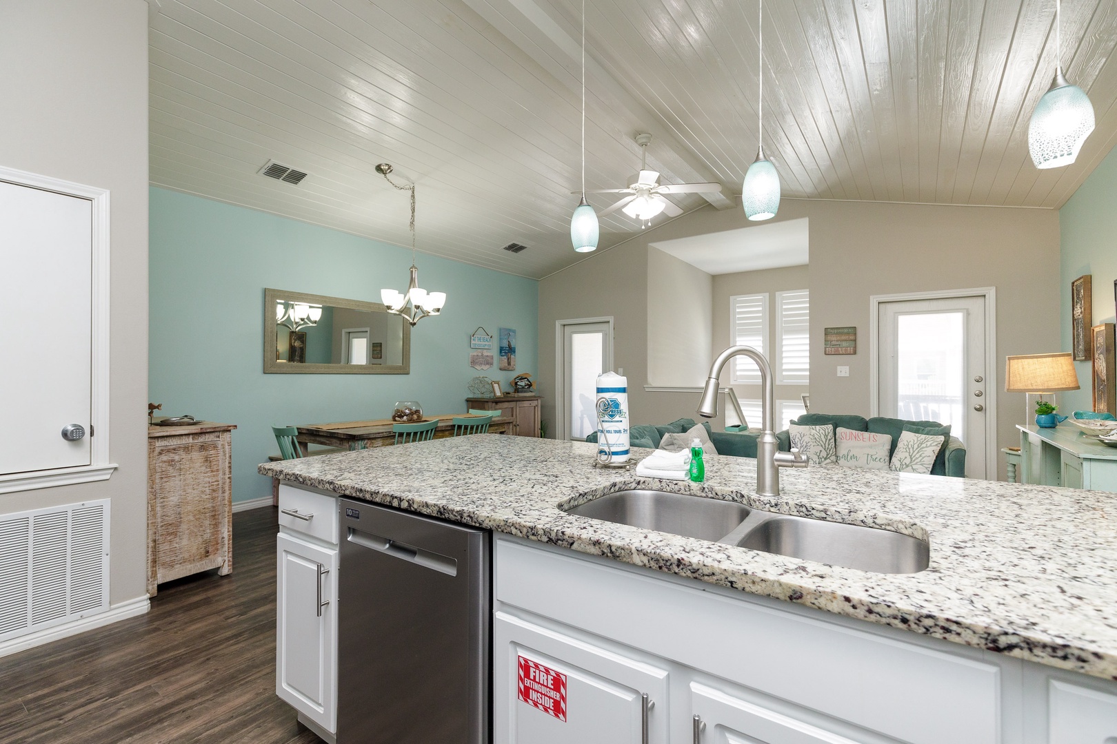 The beachy kitchen offers ample space & all the comforts of home