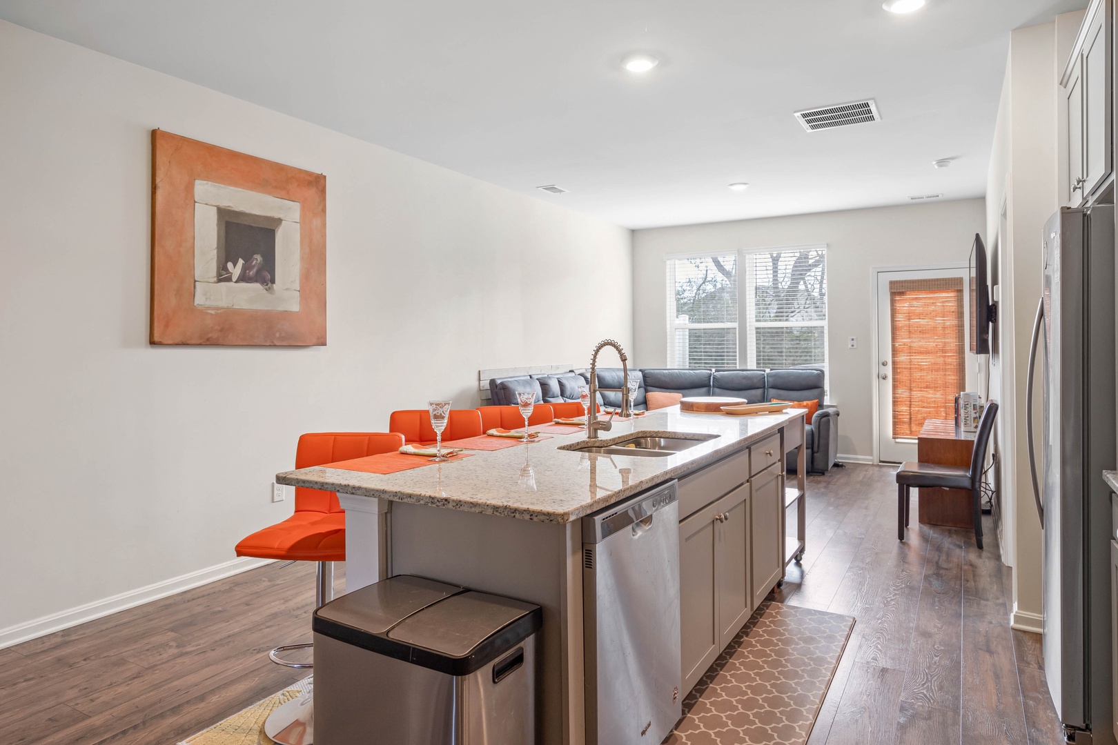 The chic, updated kitchen offers ample space & all the comforts of home