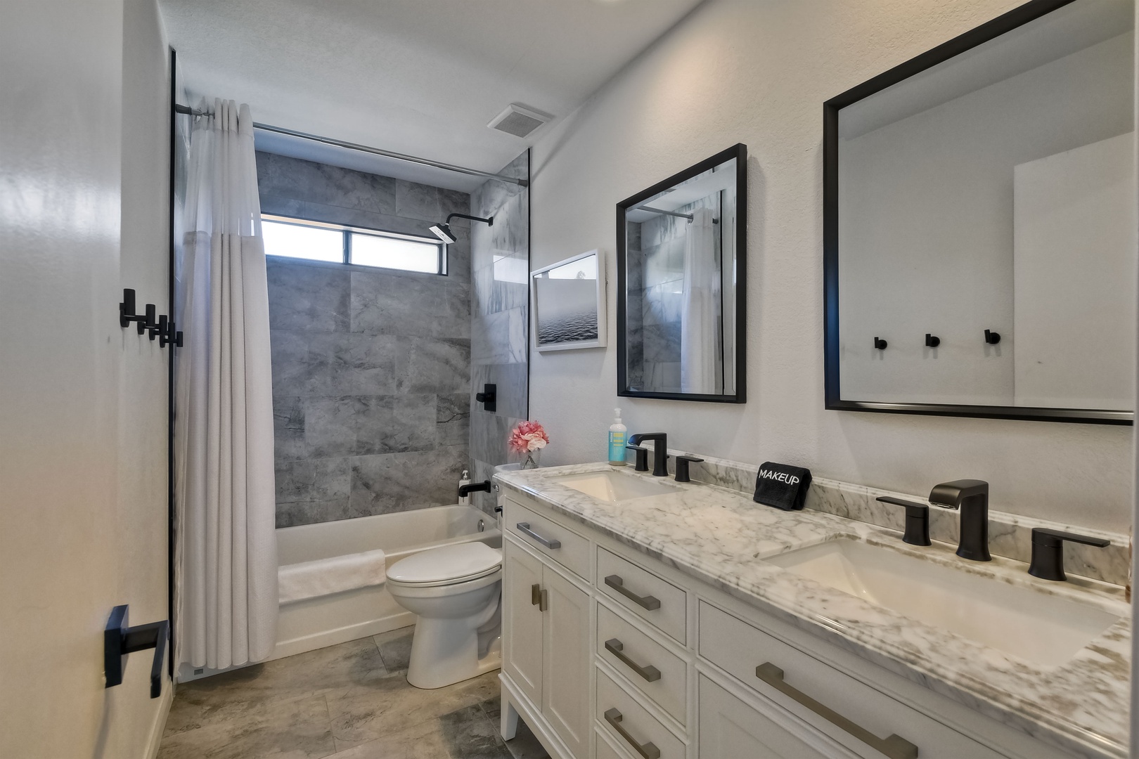 Shared bathroom with shower/tub combo