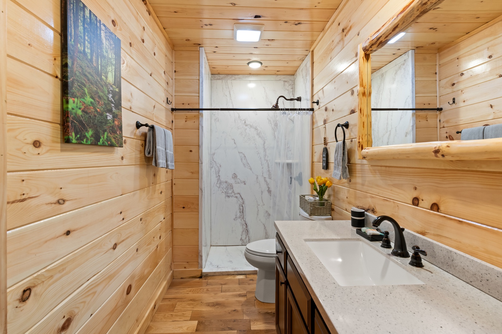 This ensuite bath features a large single vanity & walk-in shower