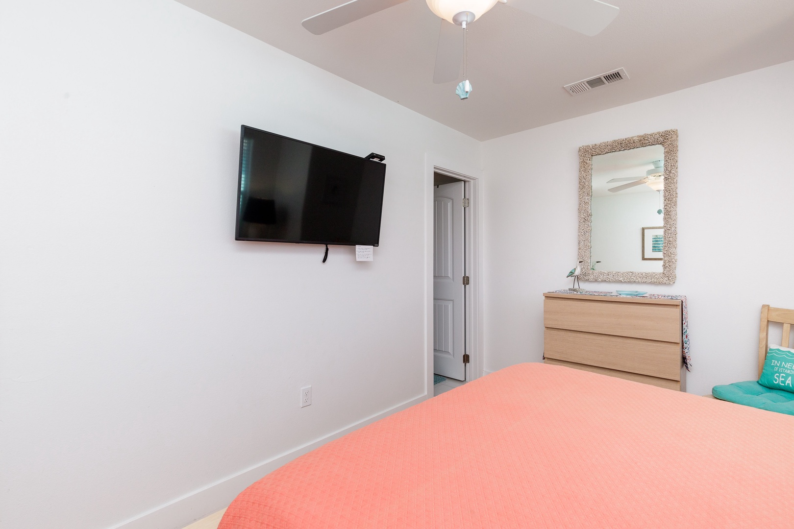 The 2nd floor queen suite offers a Smart TV, private en suite, & ceiling fan