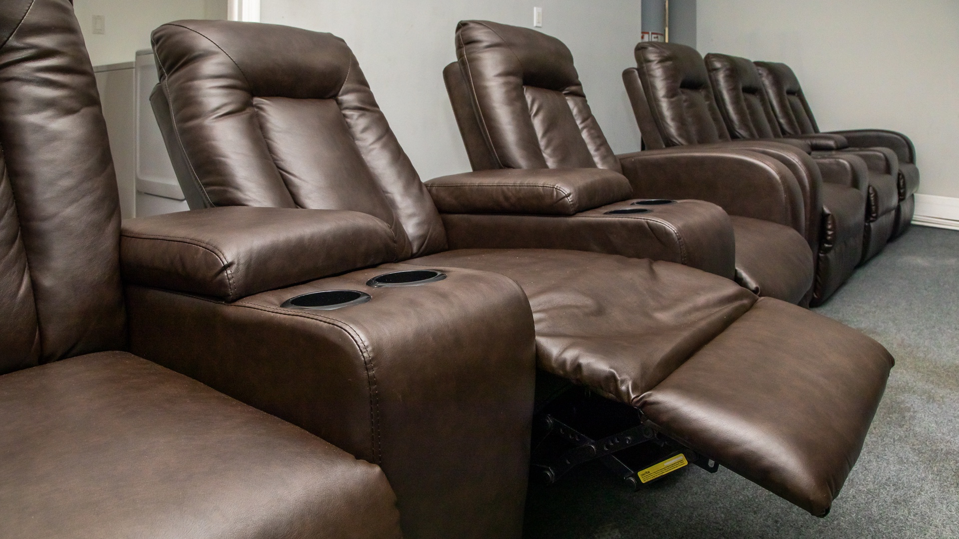 Theater-style lounge chairs in the game room
