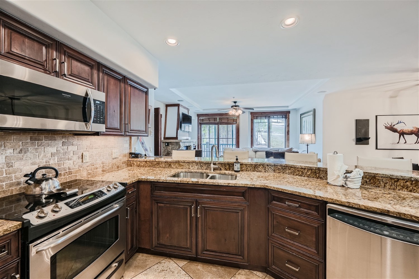 The open, elegant kitchen offers ample space & all the comforts of home