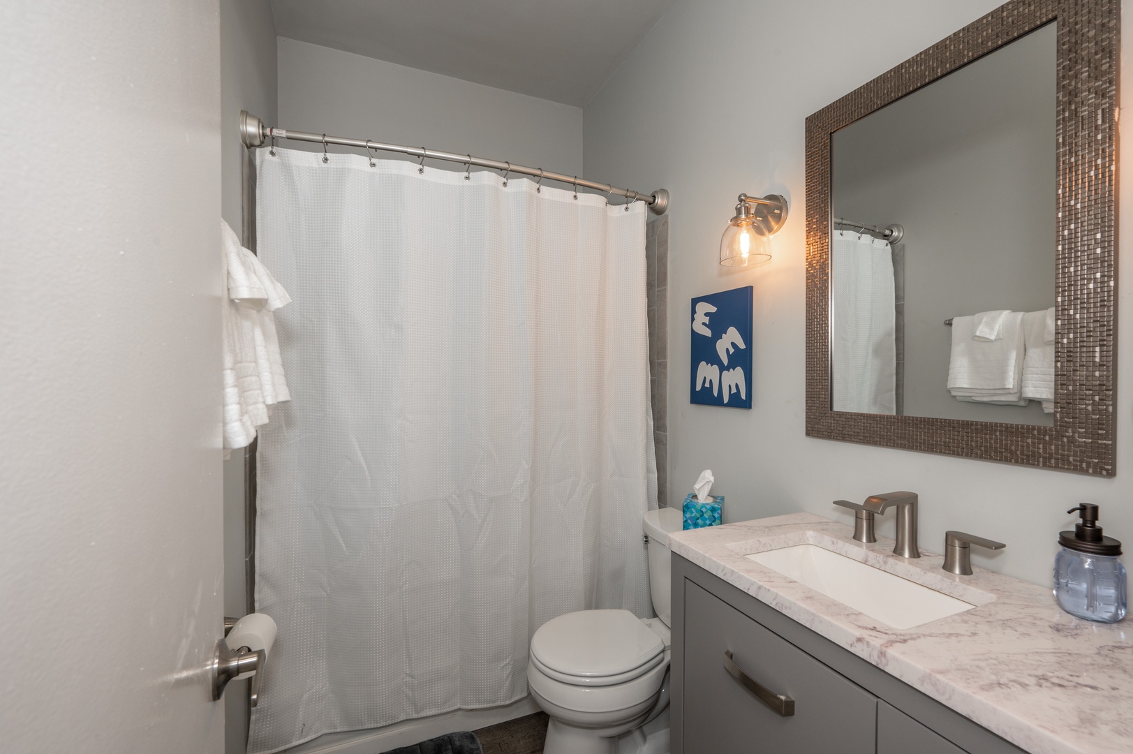 Sleek Bathroom with single vanity and shower