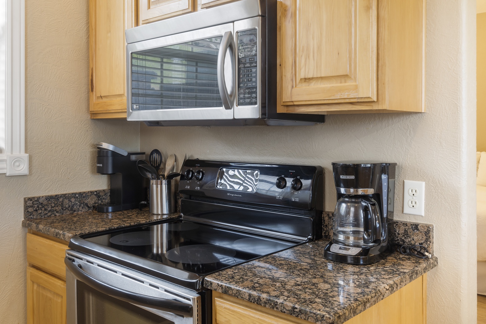 Kitchen is equipped with coffee pot, toaster and more