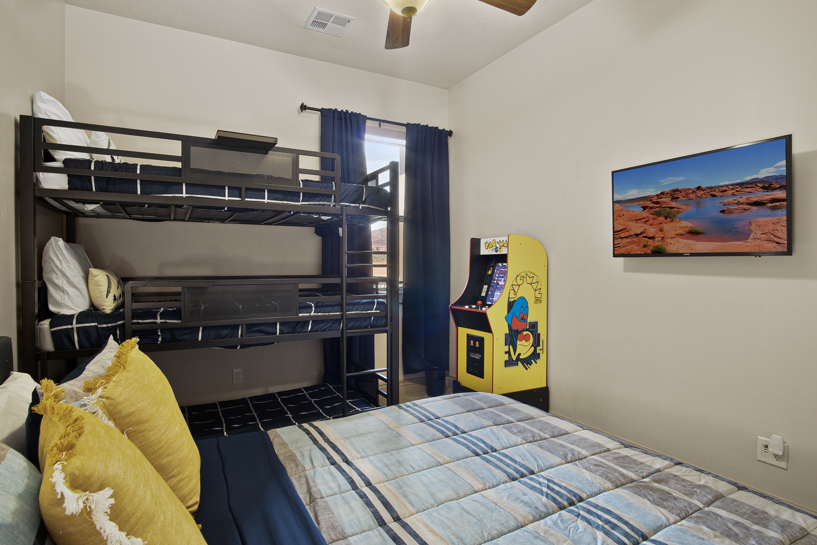 Bedroom 2 with 1 triple bunk & 1 Queen bed & Pacman Arcade